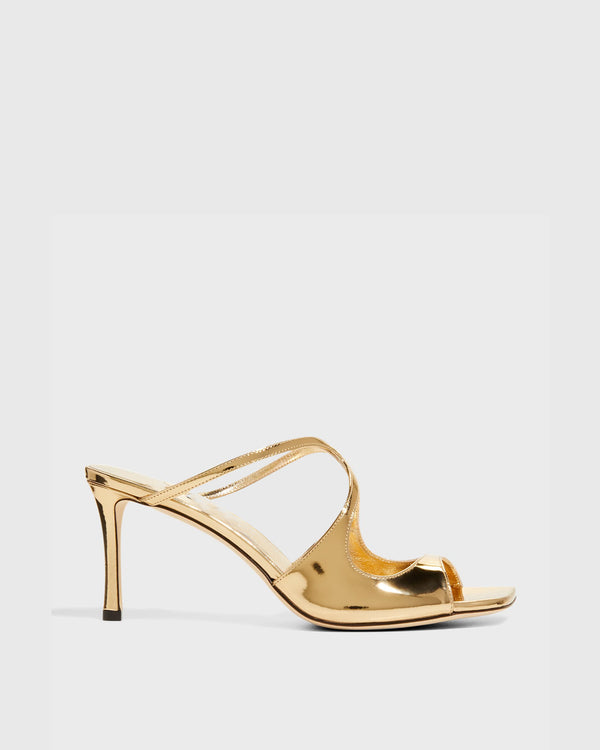 Elvia Metallic Cross Sandals In Gold