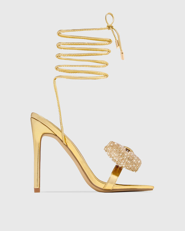 Nora Crystal Bow Lace Up Sandals In Gold