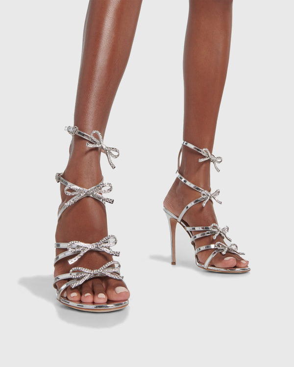 Scilla Crystal Bow Caged Sandals In Silver