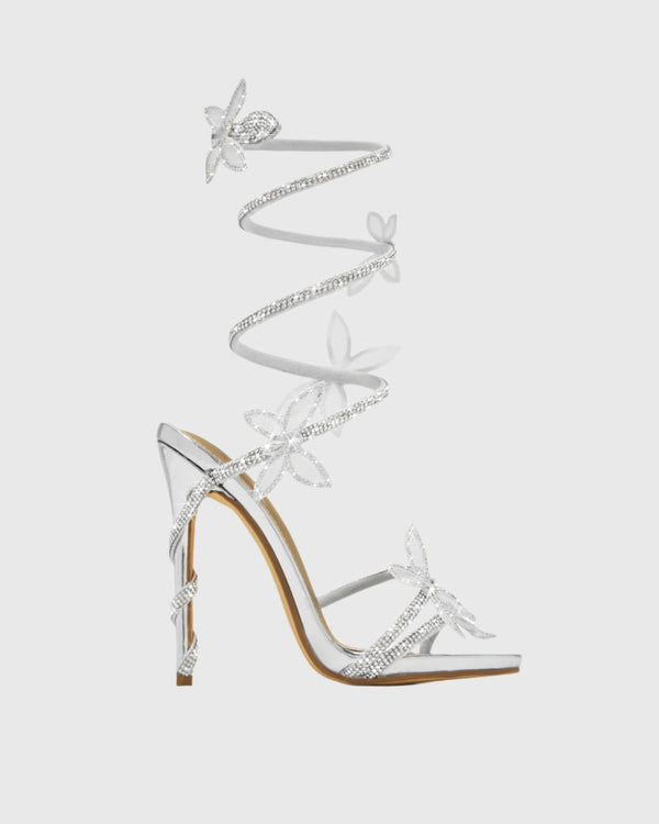 Zana Rhinestone Bow Snake Sandals In Silver